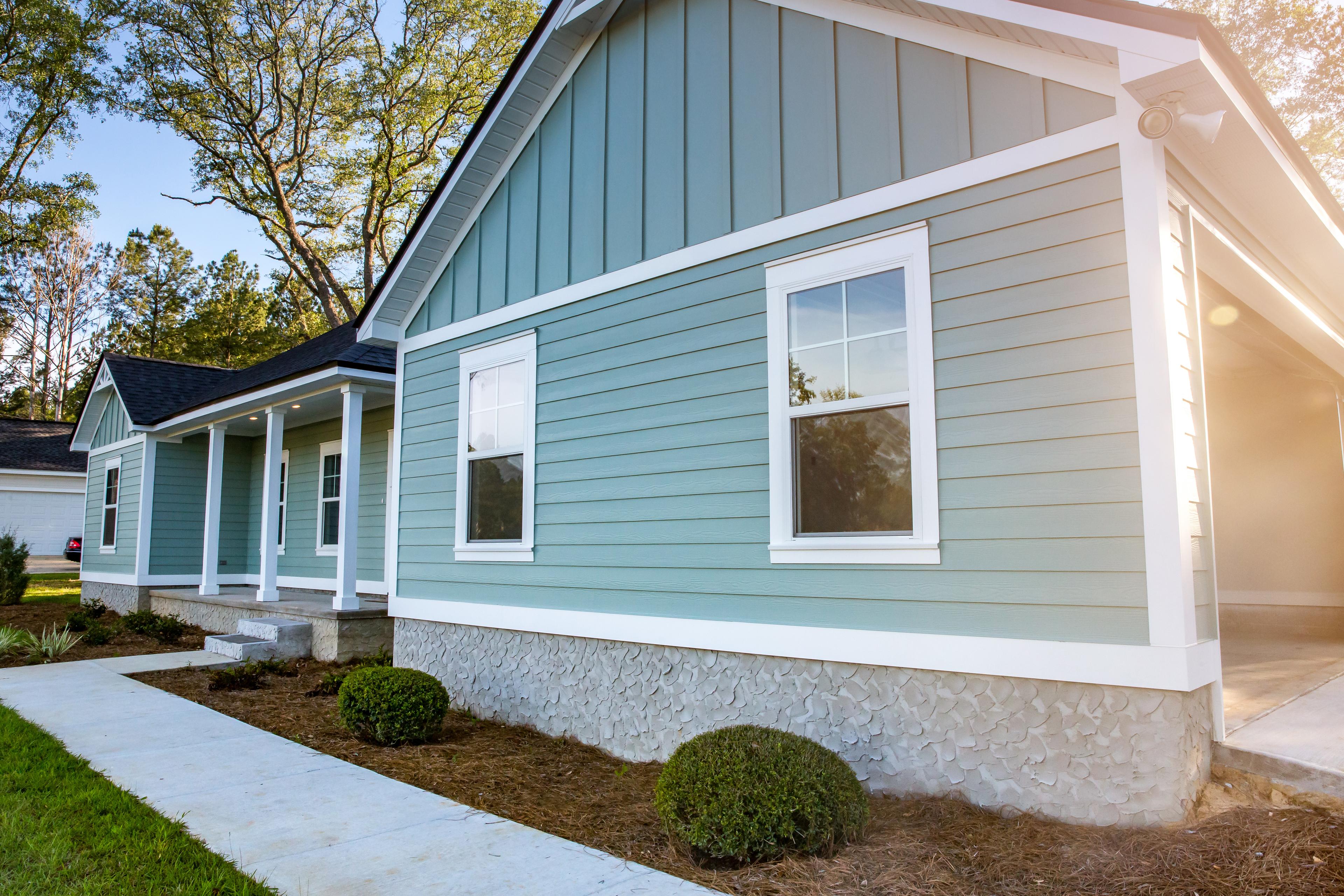 House with teal siding and white trim