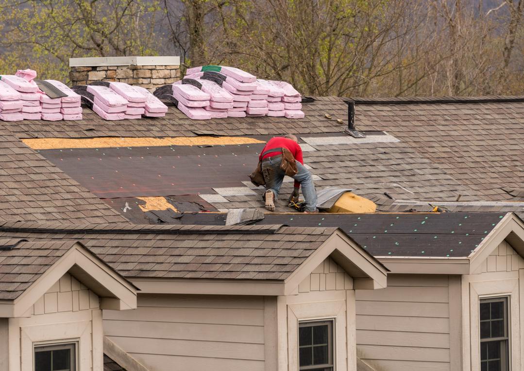 Person working on Roof.