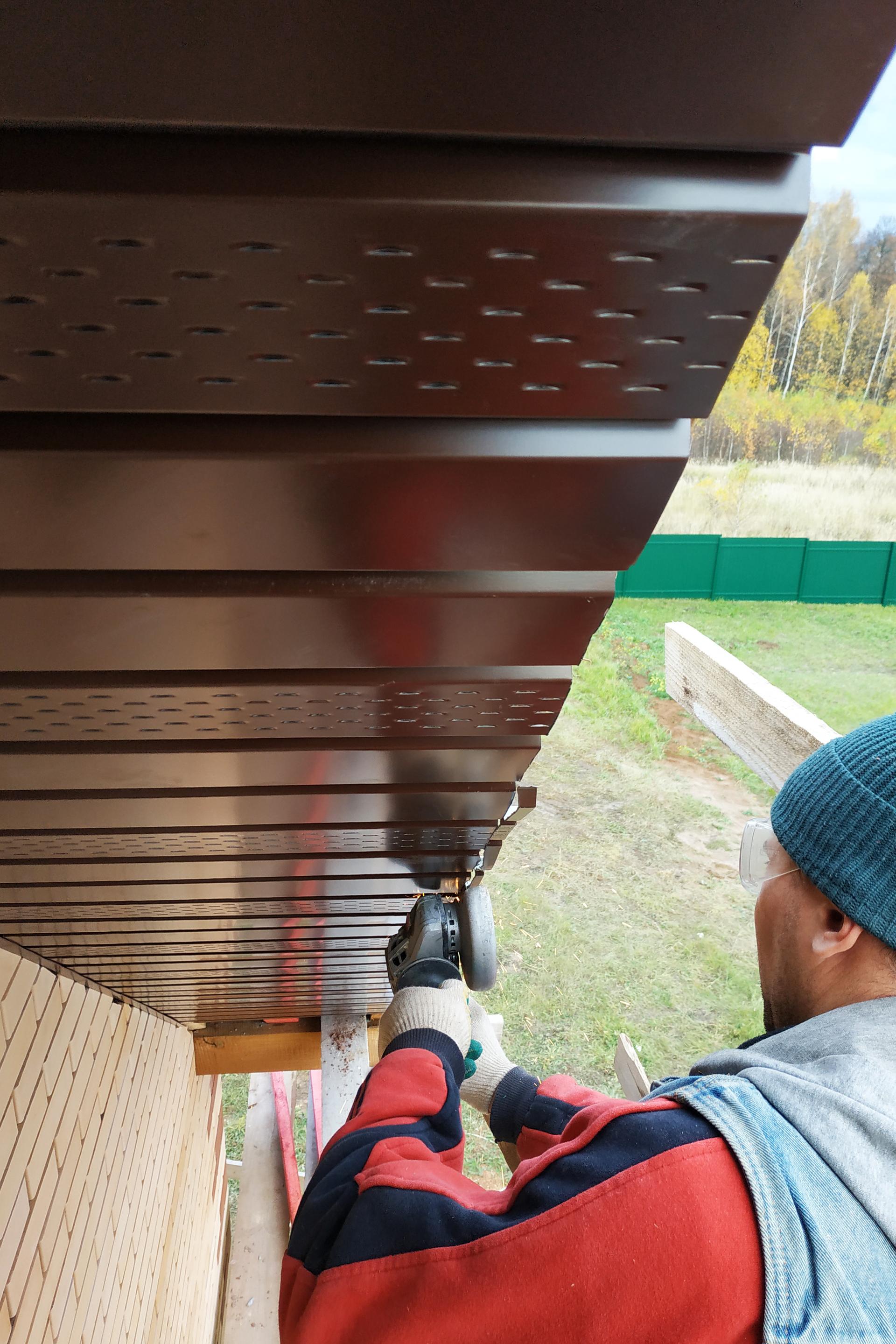 A professional replacing soffit and fascia.